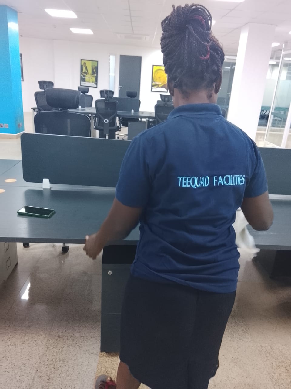 TEEQUAD facilities staff cleaning workstations