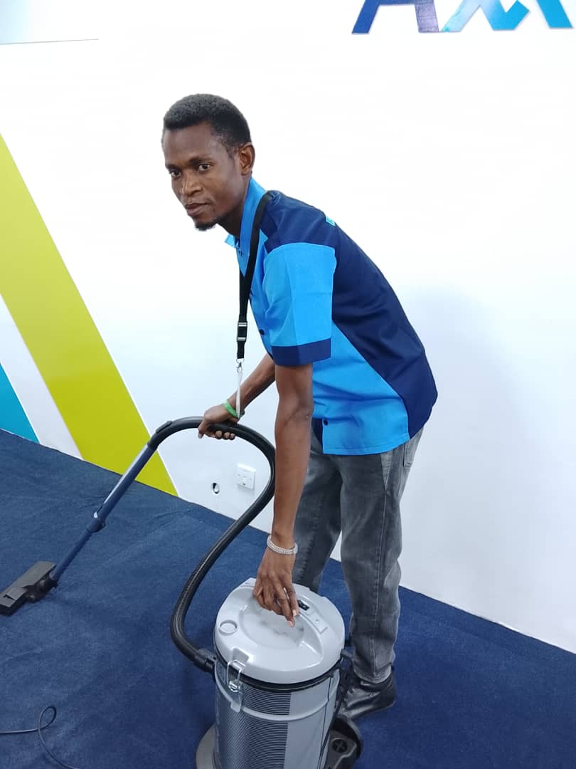 TEEQUAD technician operating industrial vacuum