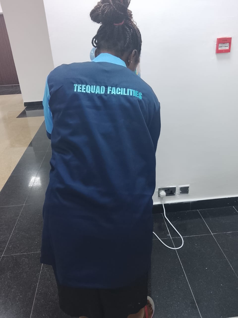 TEEQUAD facilities staff in branded uniform